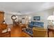 Spacious living room with classic furnishings, wood floors, and ample natural light at 9726 Sw 94Th Ter # C, Ocala, FL 34481