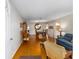Open-concept living and dining area with hardwood floors and classic furnishings at 9726 Sw 94Th Ter # C, Ocala, FL 34481