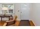 Entryway view of an interior featuring a wood floor, front window, and classic decor at 9726 Sw 94Th Ter # C, Ocala, FL 34481