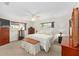 Bright bedroom with a ceiling fan, two windows, and dressers at 9726 Sw 94Th Ter # C, Ocala, FL 34481