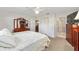 Spacious main bedroom with a large dresser and access to the bathroom at 9726 Sw 94Th Ter # C, Ocala, FL 34481