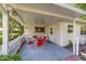 Covered patio with comfortable outdoor seating arrangement at 9726 Sw 94Th Ter # C, Ocala, FL 34481