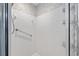 Bright white shower with grab bar and tile surround at 9726 Sw 94Th Ter # C, Ocala, FL 34481