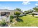 The backyard features a white picket fence and a screened in porch for outdoor relaxation at 9758 Sw 94Th Ave # A, Ocala, FL 34481