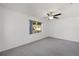 Neutral bedroom with a ceiling fan, window views and neutral carpet at 9758 Sw 94Th Ave # A, Ocala, FL 34481