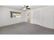 Bedroom with carpet, ceiling fan, and a window that allows lots of natural light in the room at 9758 Sw 94Th Ave # A, Ocala, FL 34481