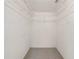 A walk-in closet with white walls and wire shelving, providing ample storage space at 9758 Sw 94Th Ave # A, Ocala, FL 34481