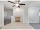 Dining room with tile floor, wooden furniture, and ceiling fan near the kitchen and living room at 9758 Sw 94Th Ave # A, Ocala, FL 34481