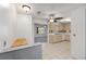 Well-lit kitchen with wooden cabinets and tile flooring, adjacent to dining area at 9758 Sw 94Th Ave # A, Ocala, FL 34481