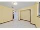 Bedroom with tile floors and trim featuring access to closet and other rooms at 10197 Sw 88Th Ter, Ocala, FL 34481