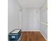 Walk-in closet featuring hardwood floors and shelving space at 10197 Sw 88Th Ter, Ocala, FL 34481