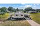 Inviting single-story home with covered parking, complemented by landscaped beds and a well-maintained lawn at 10197 Sw 88Th Ter, Ocala, FL 34481