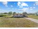 Charming single-story home featuring a large carport and well-maintained front lawn in a quiet neighborhood at 10197 Sw 88Th Ter, Ocala, FL 34481