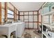 Laundry room featuring a sink, washer and shelving at 10197 Sw 88Th Ter, Ocala, FL 34481