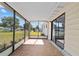 Spacious screened-in porch with concrete flooring offering views of the surrounding yard at 10197 Sw 88Th Ter, Ocala, FL 34481