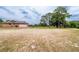 Spacious backyard featuring a garage and providing ample space for outdoor activities at 10631 W Highway 40, Ocala, FL 34482