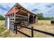 Exterior view of a well-maintained barn, ideal for agricultural pursuits at 10631 W Highway 40, Ocala, FL 34482