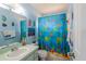 bathroom with colorful décor, single vanity and a shower/tub combo at 10631 W Highway 40, Ocala, FL 34482