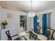 Bright dining area with French doors leading to the outdoors, adjacent to the kitchen at 10631 W Highway 40, Ocala, FL 34482