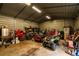 A garage full of toys and tools with overhead lighting and tools on shelving at 10631 W Highway 40, Ocala, FL 34482