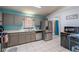 Functional kitchen with stainless steel appliances and tiled floor at 10631 W Highway 40, Ocala, FL 34482