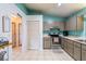 Bright eat-in kitchen features tile flooring, gray cabinets and white walls at 10631 W Highway 40, Ocala, FL 34482