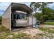 RV storage with an RV, garage and additional cars parked close by at 10631 W Highway 40, Ocala, FL 34482