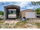 RV storage with an RV, garage and additional cars parked close by at 10631 W Highway 40, Ocala, FL 34482