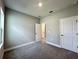 Carpeted bedroom with closet and doorways to other rooms at 13081 Sw 78Th Cir, Ocala, FL 34473