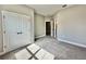 Neutral bedroom features carpet, double closet, and doorways leading to bathroom and hallway at 13081 Sw 78Th Cir, Ocala, FL 34473