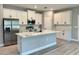 Charming, modern kitchen boasts white cabinets, stainless steel appliances, and a large island at 13081 Sw 78Th Cir, Ocala, FL 34473