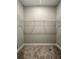 Walk-in closet includes carpeted flooring, wire shelving and painted walls at 13081 Sw 78Th Cir, Ocala, FL 34473