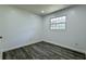 Clean and bright bedroom with gray vinyl floors at 1335 Ne 10Th St, Ocala, FL 34470