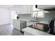 Bright kitchen featuring white cabinets, updated countertops, and stainless appliances at 1335 Ne 10Th St, Ocala, FL 34470