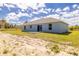 Exterior rear view of home with sliding glass doors and a concrete patio at 13493 Sw 112 Pl, Dunnellon, FL 34432