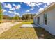 Side view of house with concrete patio in the backyard at 13493 Sw 112 Pl, Dunnellon, FL 34432