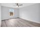Bright bedroom with grey flooring and a window with a view of the outdoors at 13493 Sw 112 Pl, Dunnellon, FL 34432