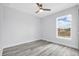 The bedroom features a ceiling fan and a window with a view of the outdoors at 13493 Sw 112 Pl, Dunnellon, FL 34432