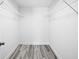 Spacious walk-in closet with wire shelving and wood-look flooring at 13493 Sw 112 Pl, Dunnellon, FL 34432