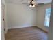 Clean and modern bedroom with new hardwood floors, ceiling fan and natural light at 14437 Sw 21St Pl, Ocala, FL 34481