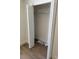 View of a bedroom closet with wooden floors, white trim and bi-fold doors at 14437 Sw 21St Pl, Ocala, FL 34481
