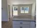 Modern kitchen featuring granite countertops, stainless steel appliances, and an open floor plan at 14437 Sw 21St Pl, Ocala, FL 34481