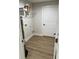 View of a laundry room with wood-look flooring and washer/dryer hookups at 14437 Sw 21St Pl, Ocala, FL 34481
