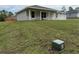 Well-maintained lawn leading to a lovely single-story home with large windows at 21 Pl # 14443, Ocala, FL 34481