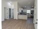Open-concept kitchen with stainless steel appliances, granite countertops, and island at 21 Pl # 14443, Ocala, FL 34481