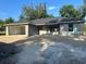 New construction home featuring a gray exterior and a covered two car port at 2871 Se 145 Pl, Summerfield, FL 34491