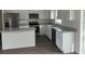 Kitchen featuring white cabinets, stainless steel appliances and gray countertops at 2871 Se 145 Pl, Summerfield, FL 34491