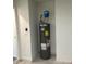 The utility room features a water heater set against a white block wall at 2871 Se 145 Pl, Summerfield, FL 34491