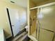 Bathroom with a tiled shower, toilet, grab bar, and tiled shower at 3 Pine Radial Ln, Ocala, FL 34472