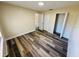 Bright bedroom features modern wood-look flooring, neutral walls, closet space, and ample natural light at 3 Pine Radial Ln, Ocala, FL 34472